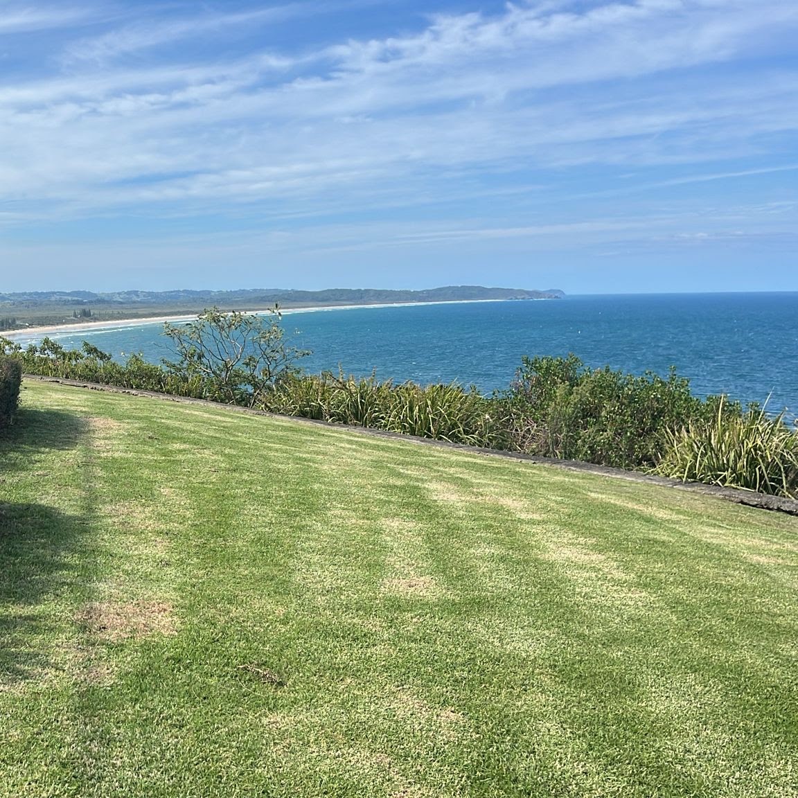Mown lawn on a headland above the beach