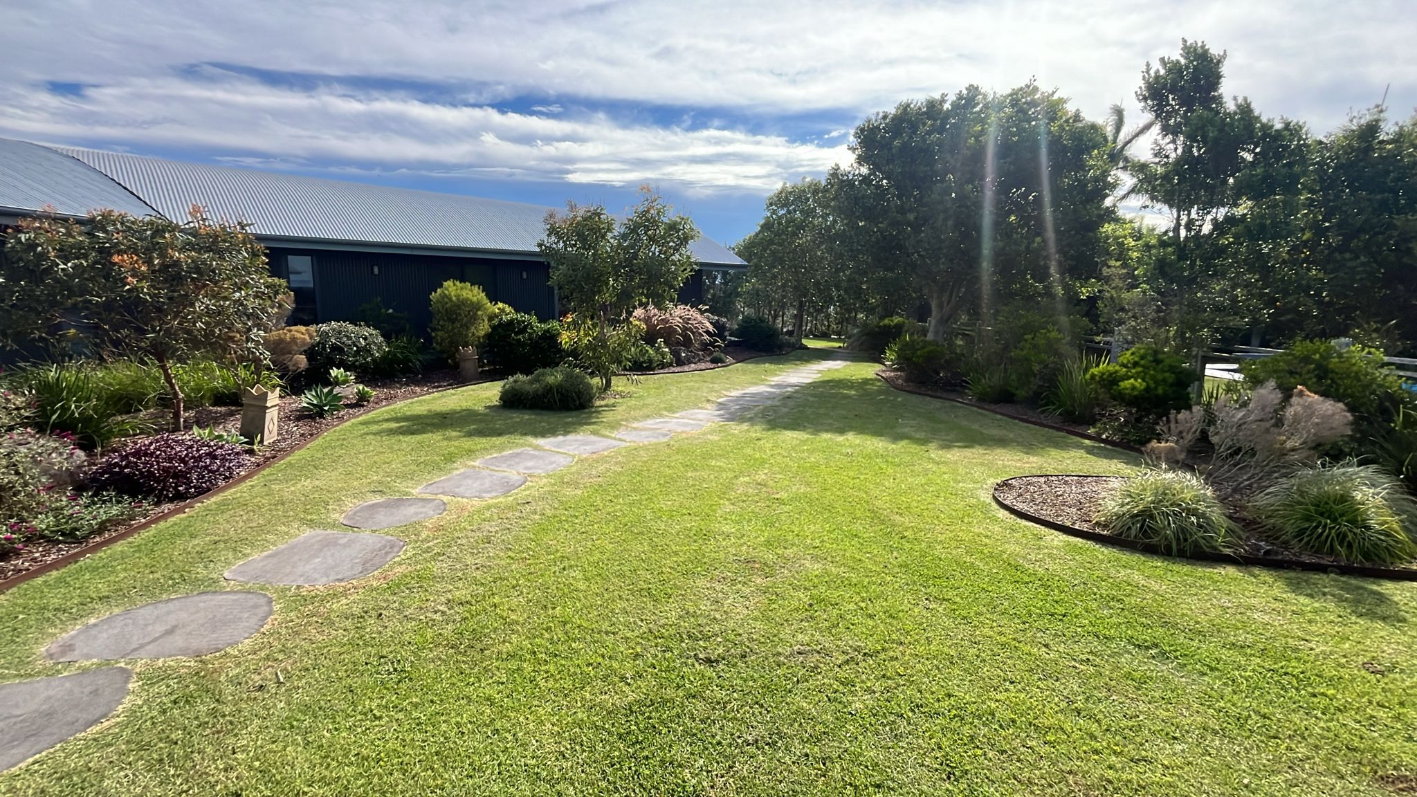 A maintained garden and lawn with stepping stones, Lennox Head